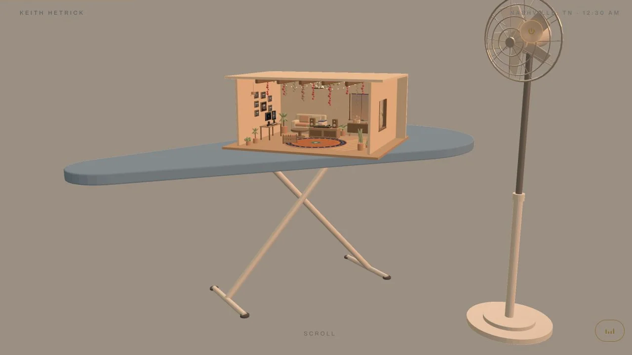 A miniature hacienda listening room on an ironing board beside a standing fan